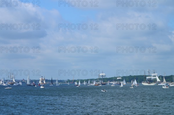 Boats and sailing ships sailing on the sea under a slightly cloudy sky, Windjammer Parade Kiel