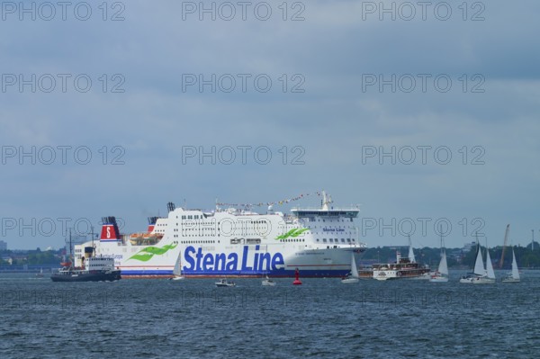 Stena Line ferry on the sea with sailing boats in the surroundings and a cloudy sky, Windjammer