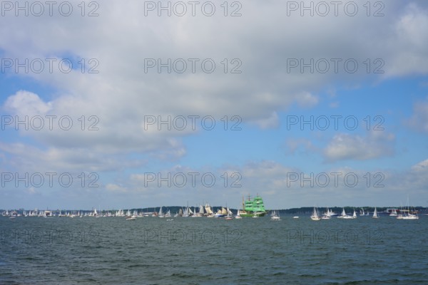 Numerous sailing boats on the sea under a slightly cloudy sky, Windjammer Parade Kiel 2025,