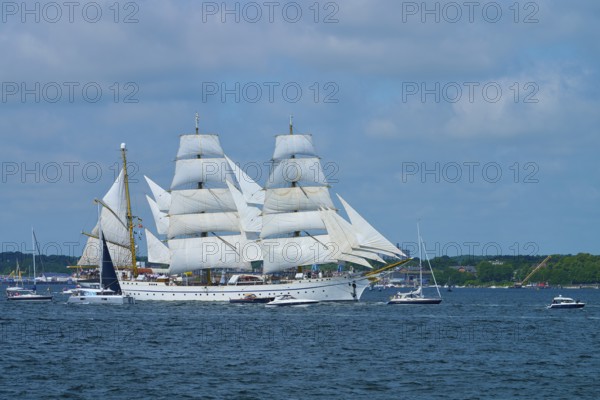 A large sailing ship Gorch Fock with white sails on the water, Windjammer Parade Kiel 2025,