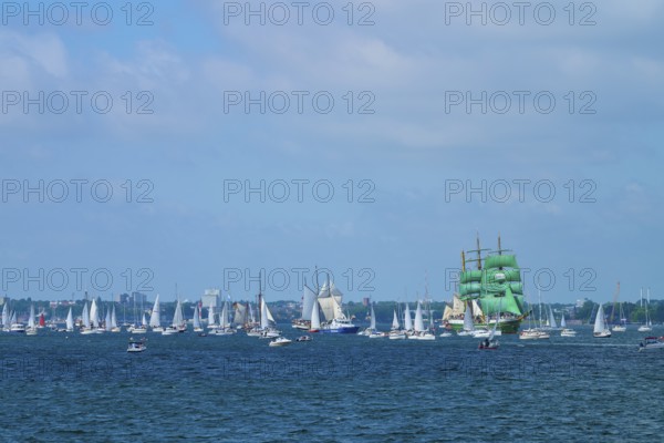 Several sailing ships on the blue sea under a slightly cloudy sky, Windjammer Parade Kiel 2025,