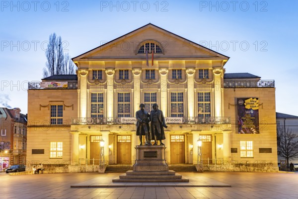 The German National Theatre with the Goethe and Schiller Monument at dusk, Weimar, Thuringia,