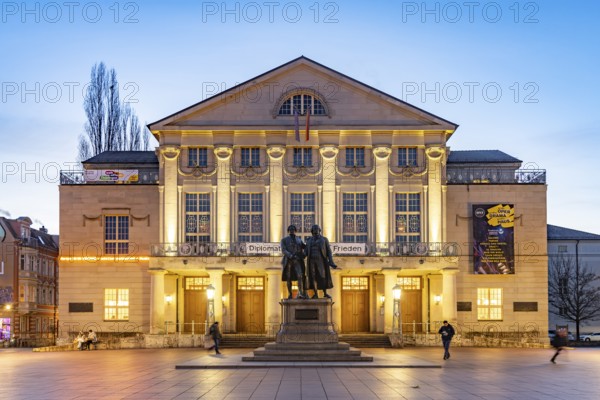 The German National Theatre with the Goethe and Schiller Monument at dusk, Weimar, Thuringia,