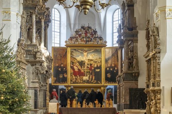 Three-panelled altarpiece Christ on the Cross by Lucas Cranach in the Stadtkirche St. Peter & Paul