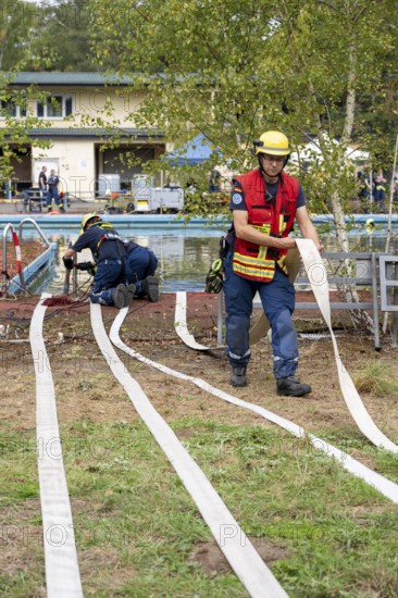Emergency services practise the use of pumps that are used, for example, during floods, at an old