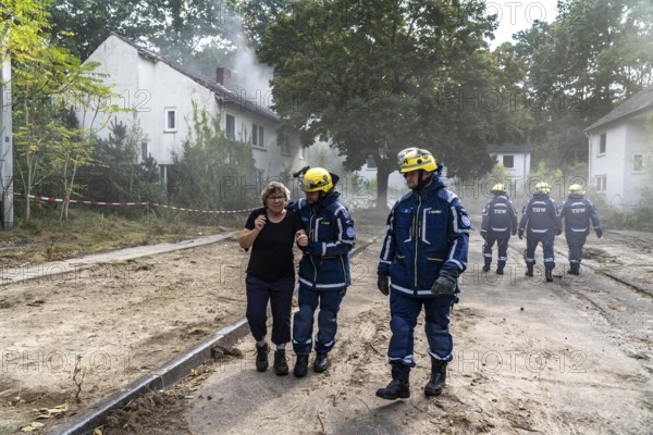 Civil defence exercise scenario, after a drone attack on a residential area, emergency services