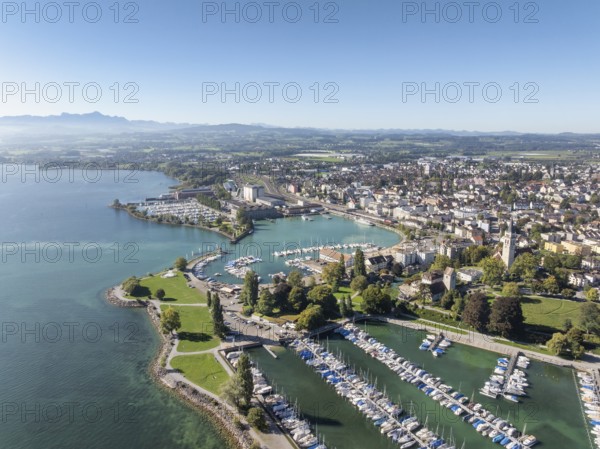 Harbour area, ferry port, yacht harbour, marina of the town of Romanshorn with Seepark, on the left
