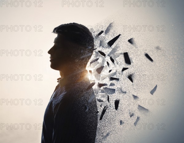 Creative image showing a silhouette of a man merging with an abstract dispersion effect and
