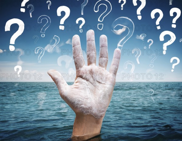 An extended hand emerges from water surrounded by floating question marks, artistically