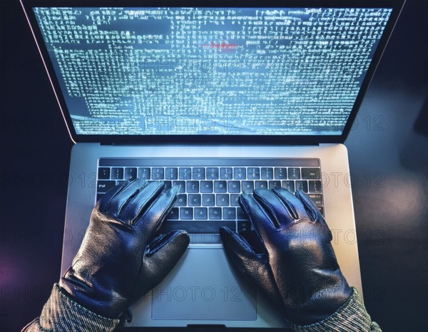 Cybersecurity threat depicted by gloved hands operating a computer, commands displayed on the