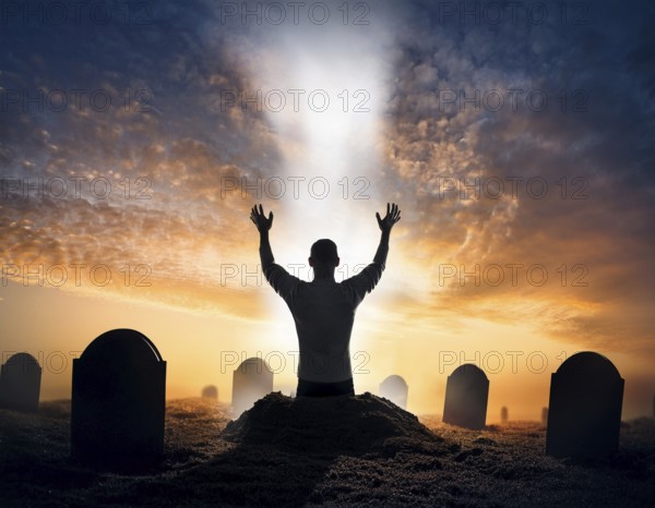 A silhouette of a lone figure walking off a gravestone, The scene evokes Resurrection thoughts