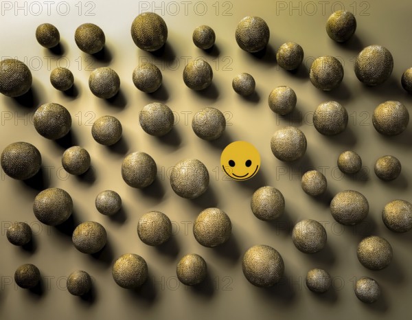 Wooden balls feature faces, one smiling among sad expressions, representing positivity or