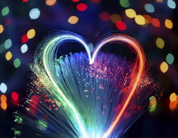 Colorful artistic display featuring vibrant light patterns shaped like a heart, expressing love and