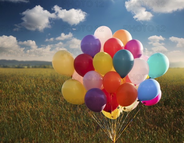 Bunch of balloons flying in the blue sky. The concept of a holiday, congratulations, gifts, events,