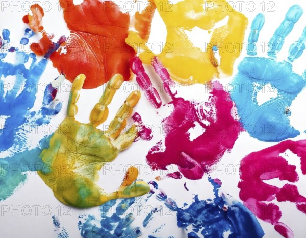 Vibrant multicolored handprints on white background, symbolizing creativity, playful expression,