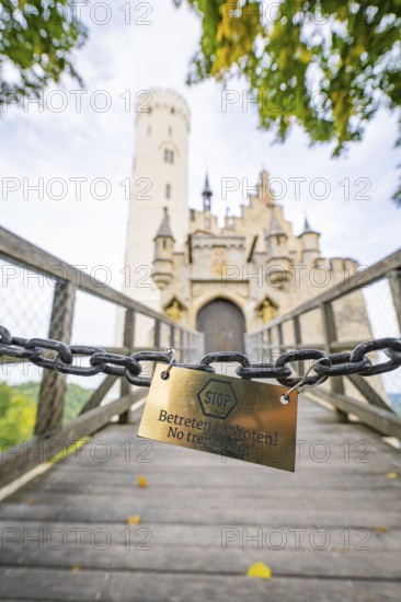 Locked chain on a bridge with a view of a castle gate, Lichtenstein Castle, Lichtenstein, Swabian