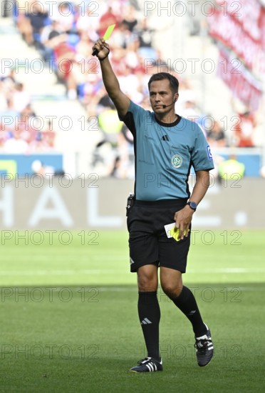 Referee Referee Robert Hartmann shows yellow card yellow caution Football Bundesliga, PreZero