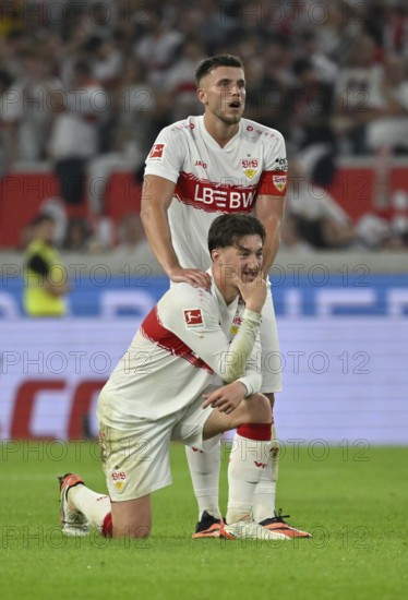 Ermedin Demirovic VfB Stuttgart (09) massages Angelo Stiller VfB Stuttgart (06) 's shoulder,