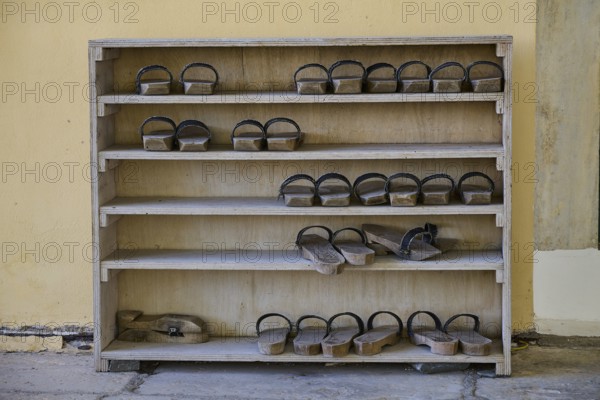 Wooden shelf with traditional sandals in the mosque, Ibrahim Pasha Mosque, Old Town, Turkish