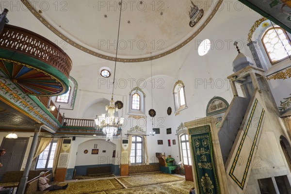 Magnificent mosque interior with chandelier and prayer rugs, Ibrahim Pasha Mosque, Old Town,