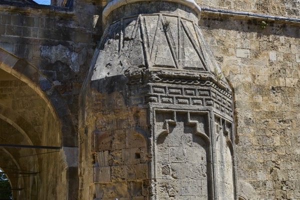 Historic masonry with detailed relief elements and play of the sun on the surface, Recep Pasha