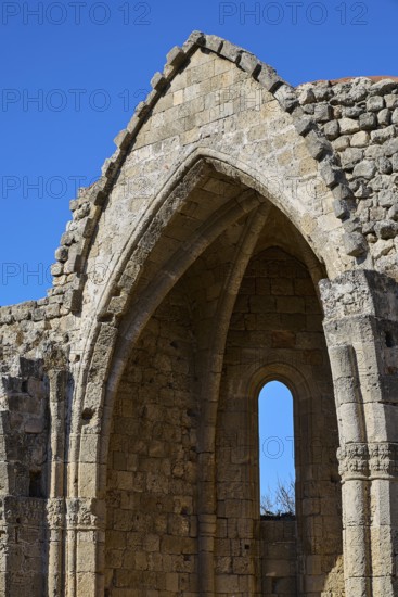 Church of Virgin Mary of the Castle, detailed view of a Gothic ruin with a striking window under a