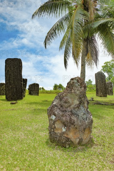 In the foreground ancient stone monolith Stone monolith in the shape of head with unexplained