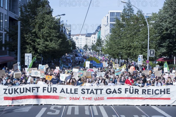 Demonstrators with front banner Future for all instead of gas for the rich on Friedrichstraße at