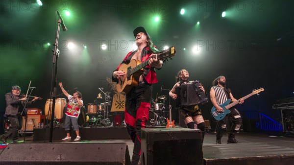 Eugene Hütz, centre, singer and guitarist, Gogol Bordello, folk-punk band, USA, live on Fall 2025