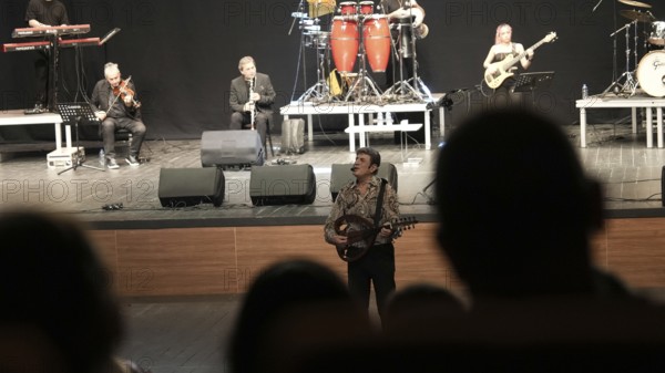 Turkish singer Coskun Sabah performs on stage at Gaziantep University as part of the Türkiye Kültür