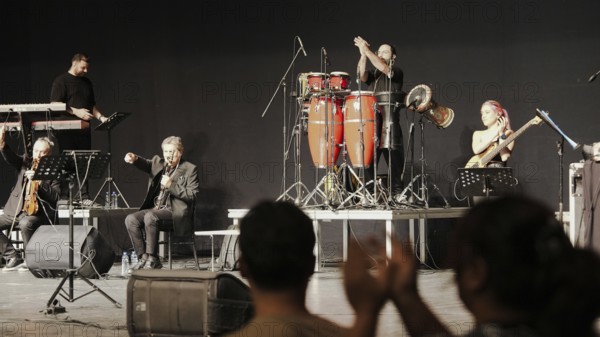 Musicians play on stage alongside Turkish singer Coskun Sabah during the Türkiye Kültür Yolu