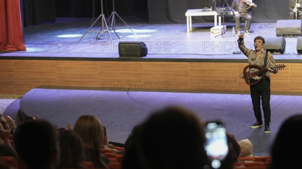 Turkish singer Coskun Sabah performs on stage at Gaziantep University as part of the Türkiye Kültür