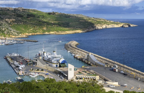 View of jetty for ferries from to Valletta island Malta and moored ferry car ferry, on the right