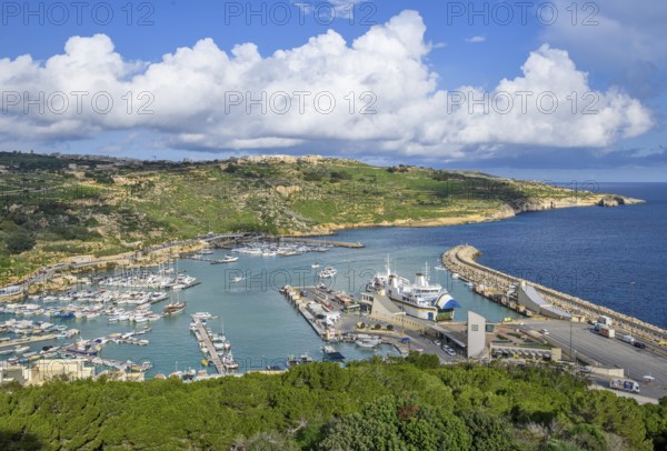 View of Gozo Mgarr Harbour harbour basin with small boats yachts yachts on the left, in the centre