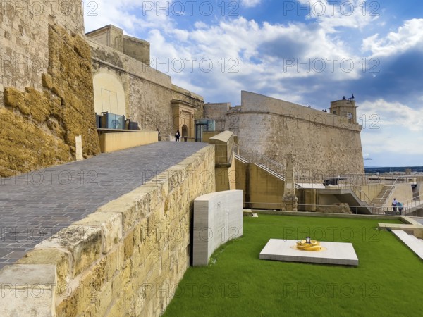 Left staircase to Tor tor of Cittadella Citadel of Gozo, bottom right monument to Ottoman invasion,