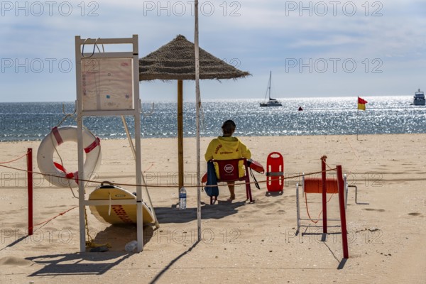 The Praia de São Roque beach, east of Lagos town centre, quite empty, lifeguards on duty,