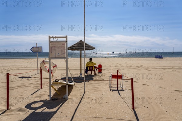 The Praia de São Roque beach, east of Lagos town centre, quite empty, lifeguards on duty,