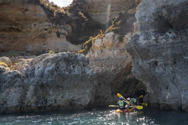 Tour with sea kayaks to the Ponta da Piedade rocky coast, rugged coastal landscape, right next to