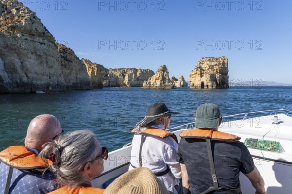 Tour with a small motorboat to the Ponta da Piedade rocky coast, rugged coastal landscape, right