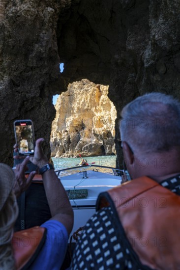 Tour with a small motorboat to the Ponta da Piedade rocky coast, rugged coastal landscape, right