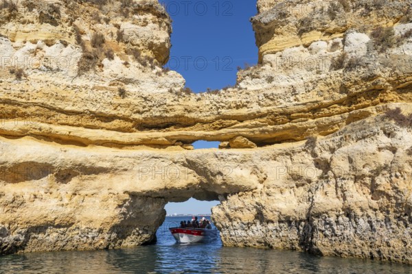 Tour with a small motorboat to the Ponta da Piedade rocky coast, rugged coastal landscape, right