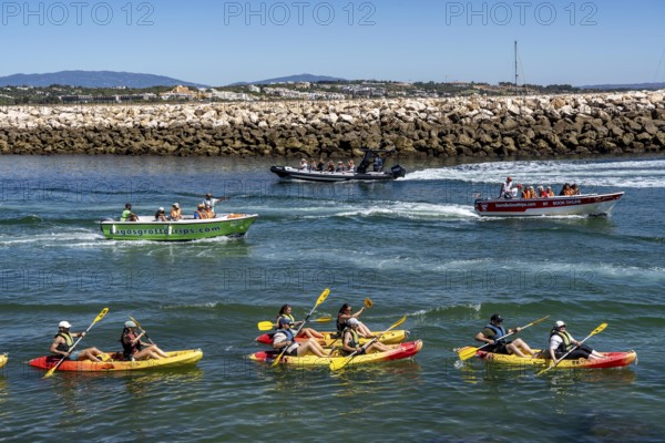 Kayak tours to the rocky coast of Ponta da Piedade, groups of tourists kayak on the sea to the