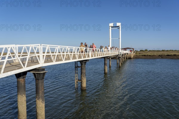 Bridge over the lagoon to the kilometre-long sandy beach Praia do Barril, on the island off Santa