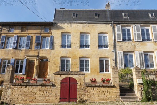 Renovated house facade, historic building, yellow sandstone, Marville, Renaissance village,