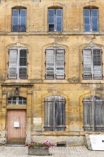 Historic house facade, abandoned building, yellow sandstone, Marville, Renaissance village,