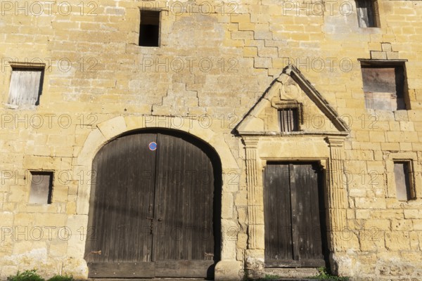 Wooden door, window, historic house facade, yellow sandstone, Marville, Renaissance village,