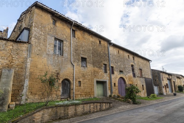 Abandoned street with historic house facades, yellow sandstone, Marville, Renaissance village,
