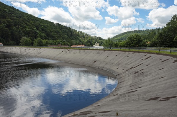Reservoir of the river Oder below the Oder reservoir with reflection of the sky with clouds, dam
