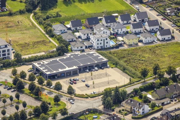 Aerial view, Aldi supermarket with solar roof and new housing estate Büscherstrasse in Bergkamen,