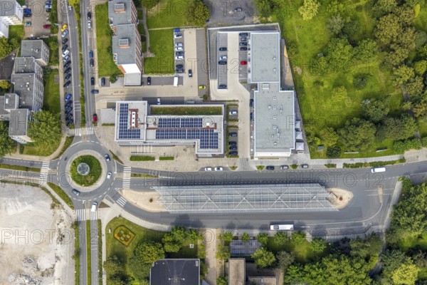 Aerial view, bus station with roundabout and savings bank building with solar roof in Schönhausen,